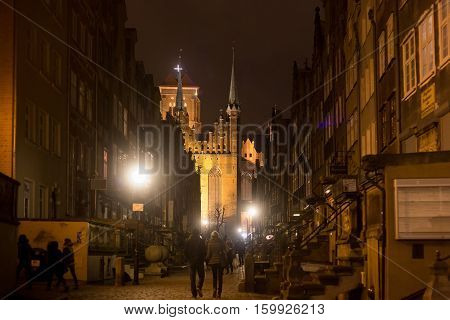 Historic buildings of Mariacka (St. Mary) street at night. Gdansk is a Polish city on the Baltic coast and popular center of tourism.