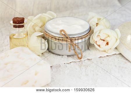 Botanical facial mask with blossom. Fresh cosmetic product in jar, beige garden rose. Pampering plant-based skincare.