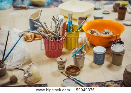 tool in pottery. Detail from pottery work room - brushes and tools