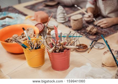 children's hands sculpts clay crafts pottery school