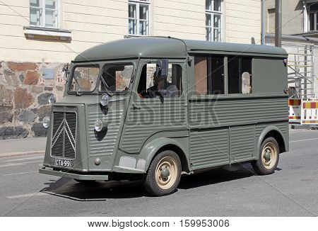 HELSINKI FINLAND - MAY 27 2016: Citroen H Van - light truck produced by the French car maker Citroen between 1947 and 1981. Green delivery van on Lonnrotinkatu stpeet Helsinki May 27 2016
