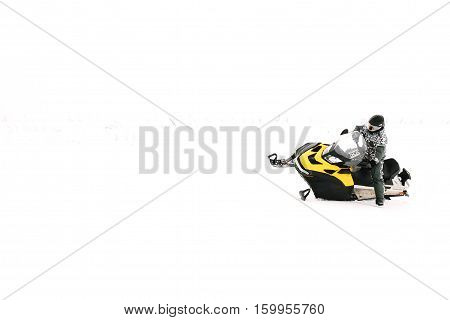 Man on snowmobile. Recreation concept on nature in winter holidays. Winter sports.