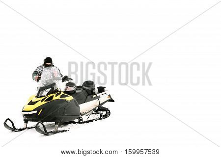 Man on snowmobile. Recreation concept on nature in winter holidays. Winter sports.