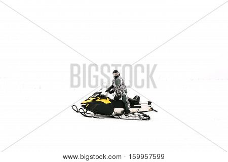 Man on snowmobile. Recreation concept on nature in winter holidays. Winter sports.