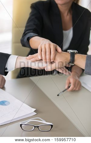 Close up of giving a high five, business contract, great and effective agreement, settled terms and conditions, payments, protect yourself as a business owner, mutual funds. Teamwork concept