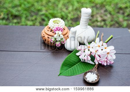 Spa massage compress balls herbal ball on the wooden with treaments spa Thailand select focus