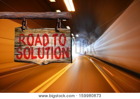 Road to solution motivational phrase sign on old wood with blurred background