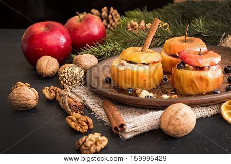 Baked Apples On Brown Plate With Holiday Christmas Decoration