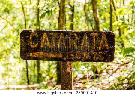 La Fortuna, Costa Rica. March 2018. A View Of A Wooden Sign For Catarata Waterfall In Costa Rica