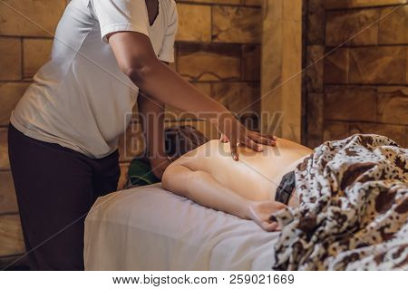 Total Relaxation. Beautiful Young Wwoman Get Balinese Or Thai Massage