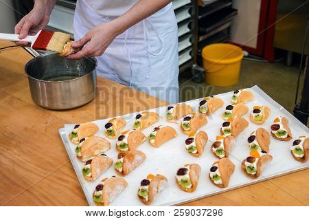 Pastry Greases Cake Syrup. The Process Of Cooking Cake.