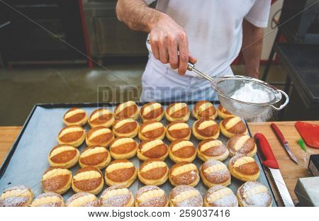 Sprinkle The Pastry With Powdered Sugar Through A Sieve.