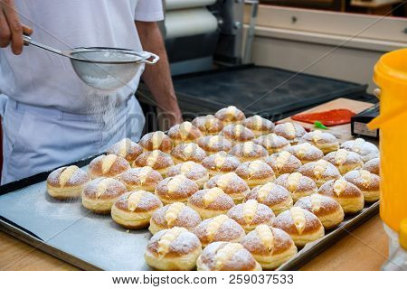 Sprinkle The Pastry With Powdered Sugar Through A Sieve.