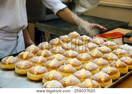 Sprinkle The Pastry With Powdered Sugar Through A Sieve.