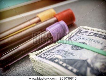 Viales Shows Blood Along With American Tickets, Conceptual Image On Sanitary Copayment