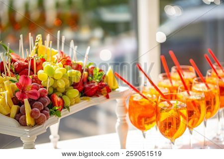 Cocktail Reception For The Wedding Ceremony. The Glasses Are Filled With Cocktails. Fruit Slicing.