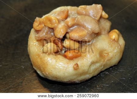 Cinammon Peanut Sticky Bun Dessert Brown Background