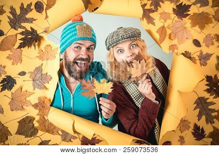Romantic Couple Wearing Pullover On Autumn Leaves Background. Autumn Woman And Happy Man On Autumn B