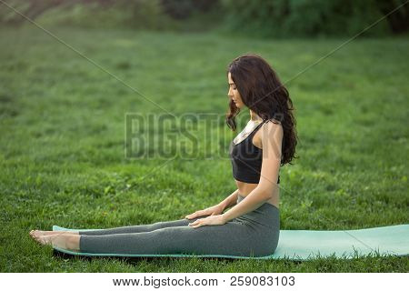 Healthy Sports Lifestyle. Young Woman Doing Workout For Stretching Body. Young Attractive Slim Girl 