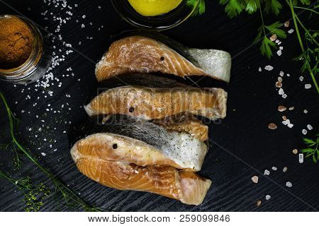 Fresh Trout Or Salmon Fish With Spices On Wooden Background