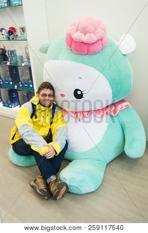 Reykjavik, Iceland - October 12, 2017: Man Traveler With Hello Kitty Toy. Leisure Traveler Man. Hell