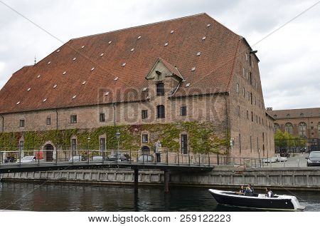 Copenhagen, Denmark - September 16, 2018: People On Boat Sailng By Canal With The Lapidarium Of The 