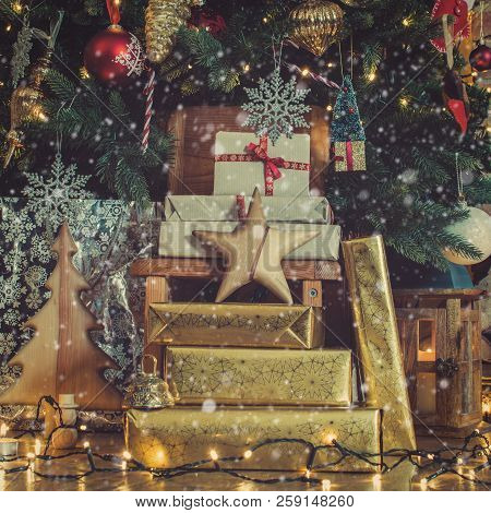 stack of presents under lit up christmas tree with baubles and ornaments lantern stars - Light Up Presents Christmas Decorations stack of presents under lit up christmas tree with baubles and ornaments lantern stars - Light Up Presents Christmas Decorations