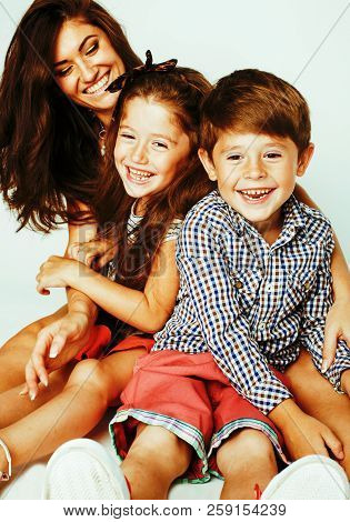 Young Mother With Two Children On White Background, Happy Smilin