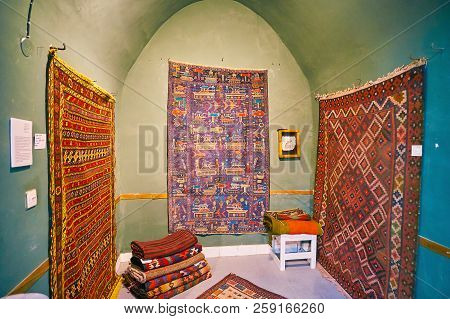 Kashan, Iran - October 22, 2017: Unusual Baluch War Carpet From Afghanistan With Tanks, Helicopters,