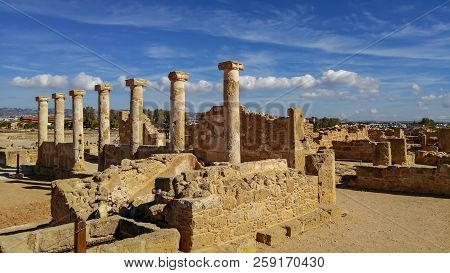 Ancient Ruins Of Kourion City Near Pathos And Limassol, Cyprus. Row Of Columns Under Blue Sky. Trave