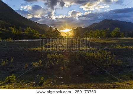 Sunset In The Mountains. The Shore Of The Chuya River, Near The Village Of Chibit. Altai Mountains, 
