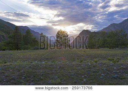 Sunset In The Mountains. The Shore Of The Chuya River, Near The Village Of Chibit. Altai Mountains, 