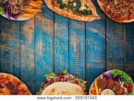 Top down view on traditional turkish meals on vintage wooden table. Close-up.