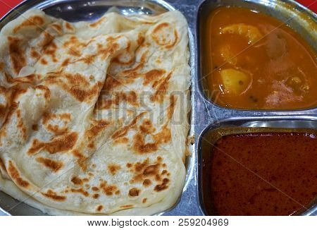 Roti Canai Is An Indian Influenced flatbread Dish Found In Indonesia, Malaysia, Brunei, And Singapor
