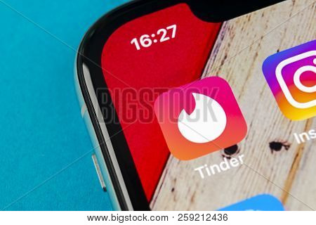 Sankt-petersburg, Russia, September 19, 2018: Tinder Application Icon On Apple Iphone X Screen Close