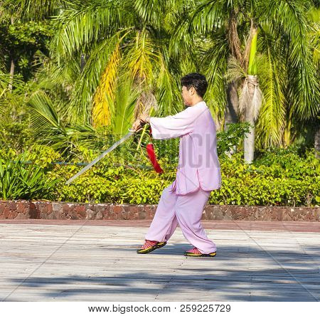 Sanya, China : 11 Nov 2017: Women  In The Street In The Park Gymnastics Wushu.