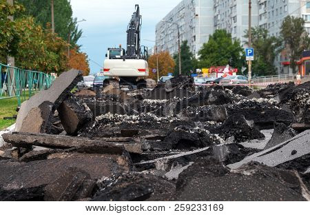 Excavator Breaking Concrete Road Surface With Hydrohammer Drill At Repairing Roadwork. Overhaul Of T