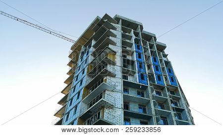 Construction Of Office Building With  Tower Crane. Building Under Construction.