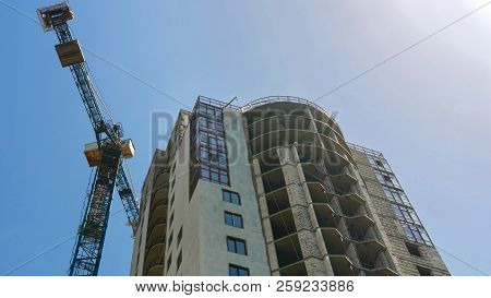 Crane Near Building. Construction Of Office Building  With Two Tower Crane. Construction Site.