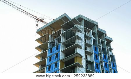 Construction Site. Construction Building. Crane Near Building.