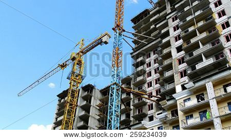Construction Site Background.. Cranes Near Construction Building.