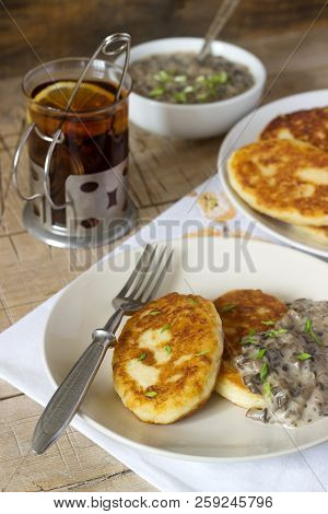 Potato Cutlets Or Pancakes With Mushroom Sauce And Green Onions. Rustic Style.