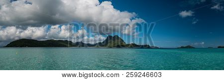 Panoramic View Of Vaitape, Blue Lagoon, White Sandy Beach And Otemanu Mountain At Bora Bora Island, 