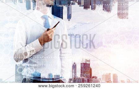 Confident And Young Businessman In Smart-casual Wear Smoking Pipe And Modern Cityscape With Business