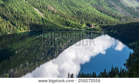 Landscape of High Tatras in the spring. Snowy mountain tops and beautiful sky. Mountain Rysy, Morskie Oko.