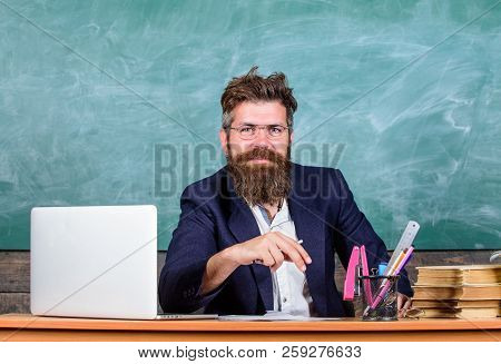 Teacher Formal Wear Sit Table Classroom Chalkboard Background. Pay Attention To Details. Teacher Con
