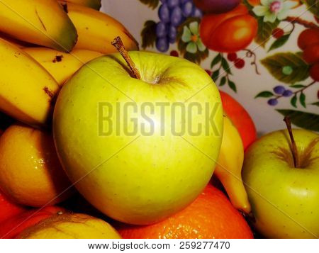 Bodegon Of Oranges, Apples, Bananas And Lemons