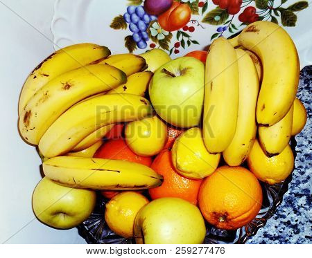 Bodegon Of Oranges, Apples, Bananas And Lemons