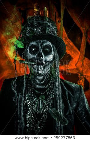 Baron Saturday. Baron Samedi. A man with a skull makeup dressed in a tail-coat and a top-hat. Dia de los muertos. Day of The Dead. Halloween.