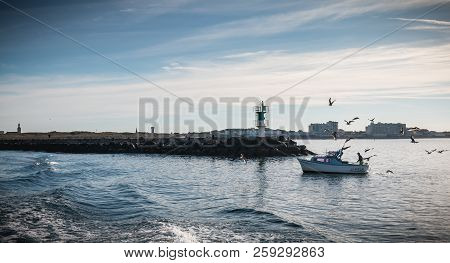 Saint Gilles Croix De Vie, France - September 16, 2018: Small Fishing Boat Entering The Harbor Accom